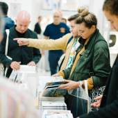 Browsing at NYABF14. Photo courtesy BJ Enright Photography.