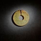 10224 Lot 202, A Superb and Rare Archaic Celadon and Russet Jade Slit Disc
