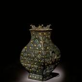 10336 Lot 578 - An Exceptionally Rare and Important Gold, Silver and Glass-Embellished Bronze Vessel (Fang Hu)