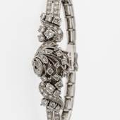 183 Brillantarmband mit Uhr WG, 585. Komplett mit Diamanten und Brillanten ausgefasstes zweireihiges Gliederarmband mit bewegten Bandanstößen. Limit	2.800,-- EUR