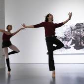 NYCB Soloist Sebastian Villarini-Velez and Corps de Ballet member India Bradley with Mark Bradford's Drag Her to the Path from Sotheby's Impressionist, Modern and Contemporary Art Evening Auction. 