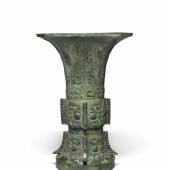 Lot 183 An Archaic Bronze Ritual Vessel (Zun)  Shang Dynasty, Yinxu Period Height 13 5/8 in., 34.6 cm Estimate $650/850,0