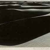 Lot 112 Edward Weston 'Wind erosion, dunes at oceano, california' mounted to board backed with dark green paper, signed and dated in pencil on the mount, titled in pencil on the reverse, framed, 1936 7 5/8  by 9 1/2  in. (19.4 by 24.1 cm.) Estimate $100/150,000