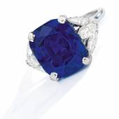 Lot 142 Property from a Family Collection, Texas An Exceptional Sapphire and Diamond Ring Set with a cushion-cut sapphire weighing 16.46 carats, flanked on either side by three marquise-shaped diamonds, Estimate $1.3/1.8 million Sold for $1,815,000