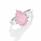 Lot 95 An Important Fancy Intense Purple-Pink Diamond and Diamond Ring Centering a pear-shaped Fancy Intense Purple-Pink diamond weighing 2.76 carats, flanked by two pear-shaped diamonds,  Estimate $1.3/1.6 million