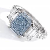 An Impressive Fancy Intense Blue Diamond and Diamond Ring, weighing 3.67 carats