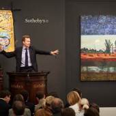 Chairman of Sotheby’s Europe, Oliver Barker, fields bids at Sotheby’s sales of Italian and Contemporary Art.