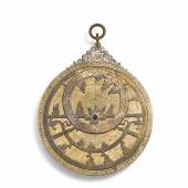 Lot 123, A Mamluk silver and gold-inlaid brass astrolabe, signed by Muhammad ibn Abi Bakr al-Qawwas, Syria, dated 752 AH, 1351-2 AD, with later rete, alidade and three plates, Ottoman period (est. £200,00-300,000).