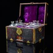 Lot 137 - Lord Nelson's Grog Chest - A Travelling Chest with Decanter Set, Wine Glasses and Beaker for Lord Nelson, circa 1800 (est. £35,000-45,000)