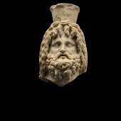 Lot 19 A Roman Marble Head of Sarapis,  Egypt,  circa 1st Century A.D. Estimate: £30,000-50,000