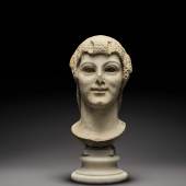 Lot 20 A Roman Marble Archaistic Head of a Young Woman,  circa 2nd Century A.D. Estimate: £100,000-150,000 