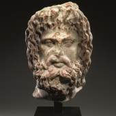 Lot 26 A Roman Marble Head of Sarapis, late 2nd century AD