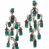 Pair of emerald, ruby and diamond ear clips Lot 620, Estimate: CHF 18,000 – 25,000 / US$ 18,000 – 25,000