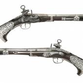 Losnummer 334: Seltenes Paar südamerikanischer Steinschlosspistolen (Typ Miquelet) vom Kaliber 20 mit Silbermontierung, Schätzpreis 17.000/21.000 €