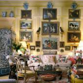 Mario Buatta’s Manhattan apartment photographed for Architectural Digest in 1997. The living room is glazed in three shades of lime green and creamy white, with a faux-sisal painted floor. Over the sofa hangs Mario’s collection of dog paintings. Mario often joked, “These paintings are my ancestors. Seriously, I love dogs. I don’t have a dog because I have such a busy schedule, but I love viewing them on the wall.” Photo: Scott Frances for Architectural Digest/Otto Archive