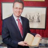 Seth Kaller holds a copy of Thomas Paine’s Common Sense. Initially, Kaller explained, Robert Bell of Philadelphia published the pamphlet in January 1776, and it sold out quickly. Paine asked Bell to hold off on a second issue to allow time for supplementary work.  $68,000. 