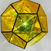 Olafur Eliasson, Your polyamorous sphere, 2022, coloured glass (yellow, blue), colour-effect filter glass (green), stainless steel, paint (black), LED light, aluminium, ⌀ 1.2 m. Courtesy the artist and PKM Gallery 