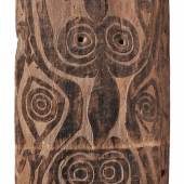 A SISSANO LAGOON SHIELD  Papua New Guinea  Of rectangular form, the scorched surface carved in shallow relief with scrolling fish motifs, two holes for retention of handle (now missing).  153.5 cm. high  Schätzpreis: €7.000 - €9.000, Ergebnis: 18.000  