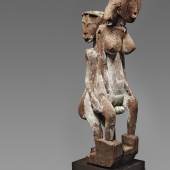 A SAKALAVA FUNERARY POST  Madagascar  Carved as an erotic couple, the male standing behind the female, weathered patina with traces of white and green pigments.  85 cm. high   Schätzpreis: €15.000 - €20.000
