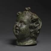 GALLERIES/DANIEL KATZ GALLERY LTD, Roman 2nd century AD  Infant Bacchus steelyard weight  Bronze, with silver eyes and filled with lead  20 cm high
