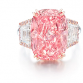 Image above showcases The Williamson Pink Star flanked by trapeze-cut diamonds and embellished with brilliant-cut diamonds, mounted in 18 carat gold.