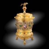 CUP AND COVER SET WITH JEWELS AND ENAMELS LORENZ BILLER II Silver Gilt, emeralds, rubies and turquoise Height to top of finial 28 cm (11 in.) Augsburg - 1710