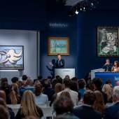 Sotheby's Chairman and Auctioneer Oliver Barker fields bids in Sotheby’s Modern Evening Sale 