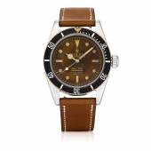 LOT 210 ROLEX ‘FOUR LINE BIG CROWN’ SUBMARINER, REF 6538 STAINLESS STEEL WRISTWATCH WITH TROPICAL DIAL CIRCA 1959  CHF 100 000-200 000/USD 101 000-202 000