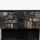 Lot 187 Property From A Private New York Family Paul Evans "Sculpture-Front" Cabinet lacquered and gilt steel and slate 35 x 99 x 22 3/4  in. (88.9 x 251.5 x 57.8 cm)  circa 1970 executed by Paul Evans Studio, New Hope, PA Est. $100/150,000 Sold for $ 162,500 