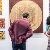 visitor exploring art at hong kong fair 2018